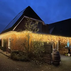 Luksus Lichtgordijnen^™ Led Gordijn - Ijspegel Verlichting | 360 Led Lampjes Extra Warm Wit / Amber | Voor Binnen En Buiten | 7 + 10 Meter Snoer | 8 Lichtstanden & Timer Functie